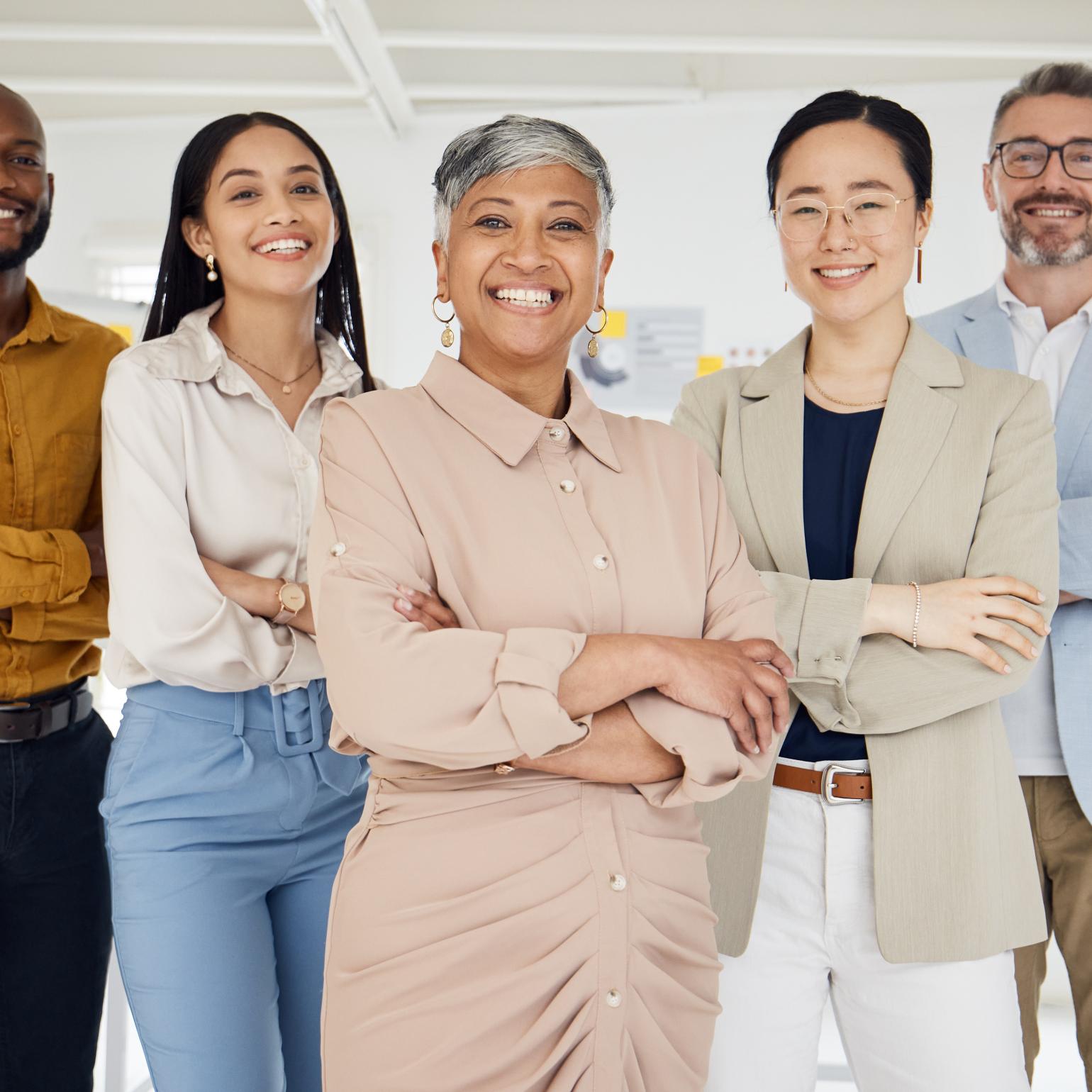 Diverse group of people standing and smiling